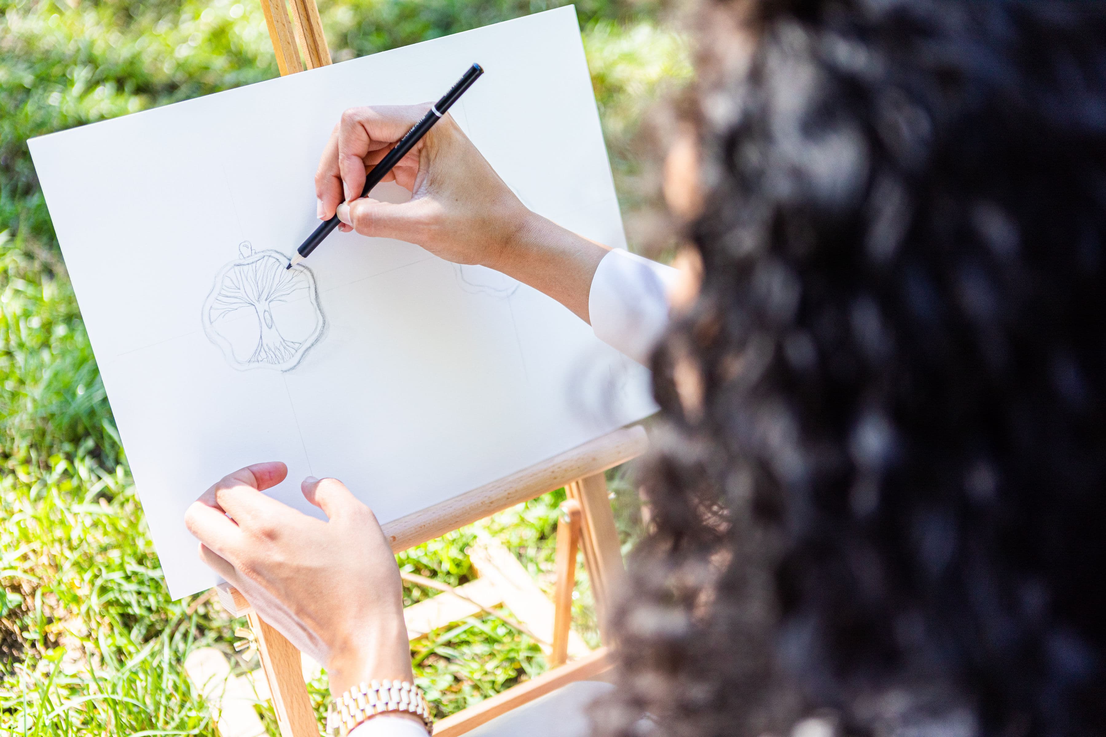 Woman wearing 8 number necklace with denim jacket